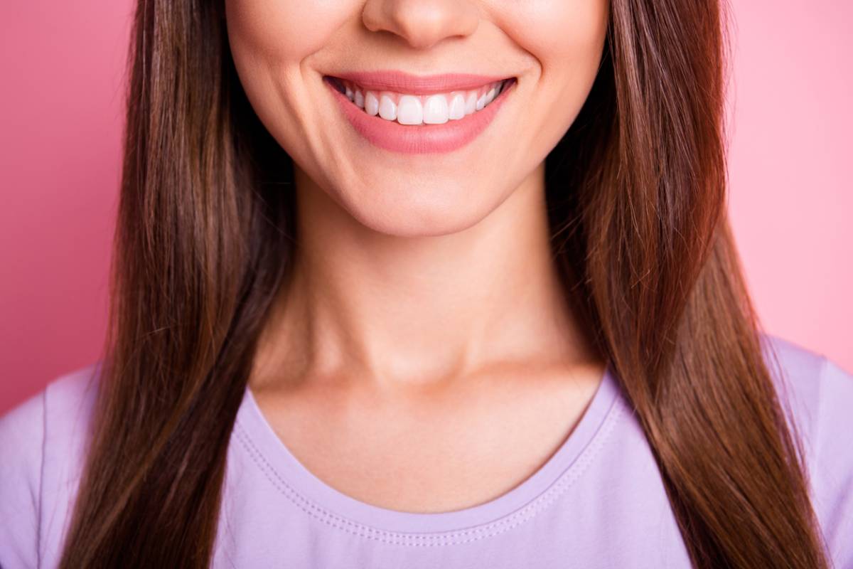 Woman who has some questions about dental veneers and a bright smile